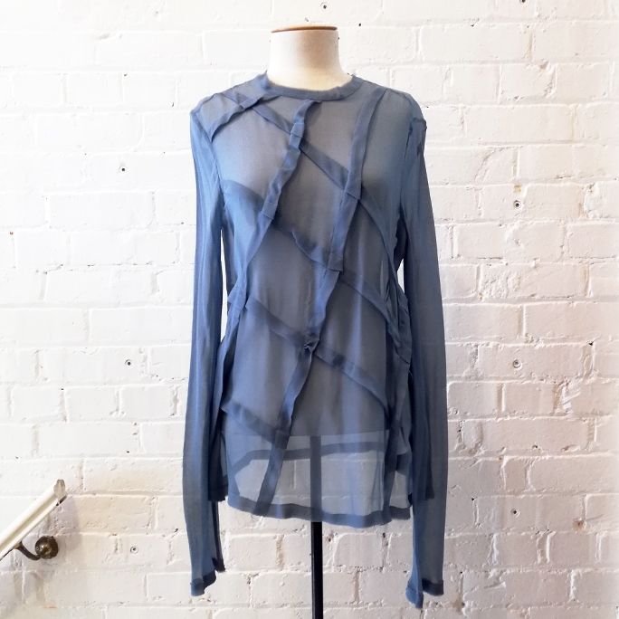 Silk top with criss-cross detailing.