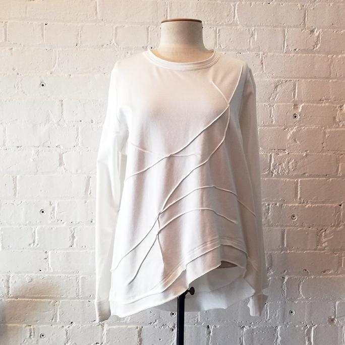 Cotton crew top with geometric stitch pattern.