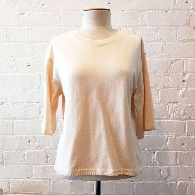 Cropped crew top with blanket stitch detail.
