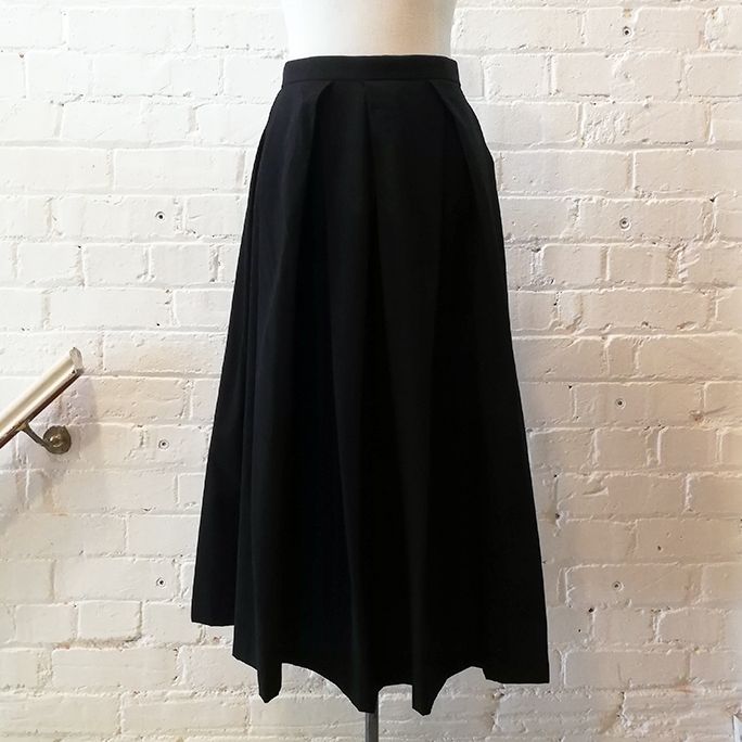 Box-pleat wool skirt.