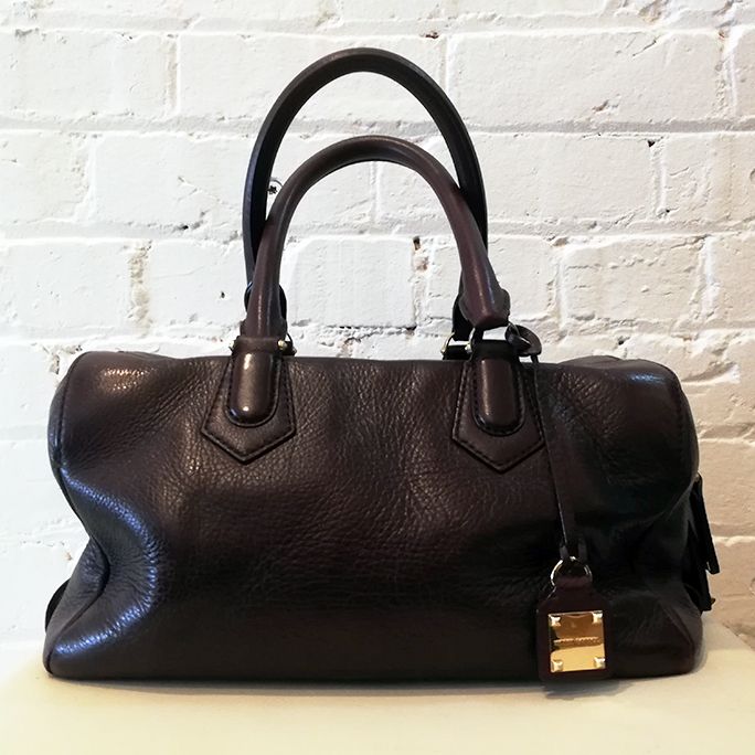 Soft leather hand bag with shoulder strap and dust bag.