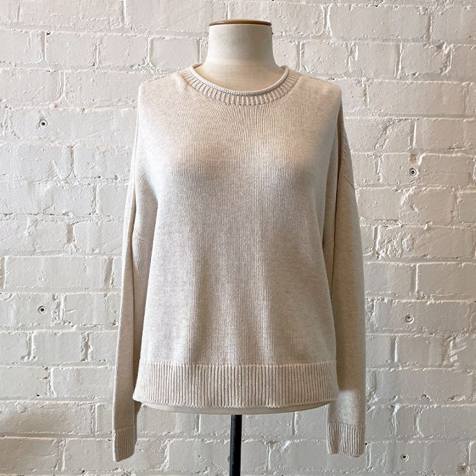 Loose-weave roll neck knit with boxy body and drop shoulder.