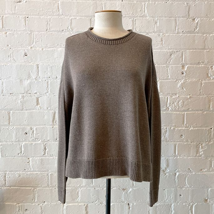 Loose-weave roll neck knit with boxy body and drop shoulder.