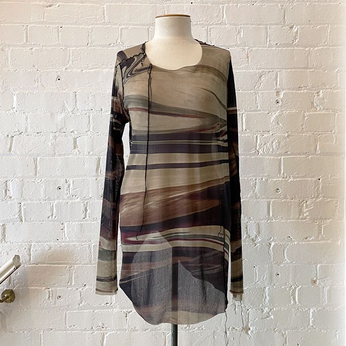 Long line mesh top with deconstructed edges.