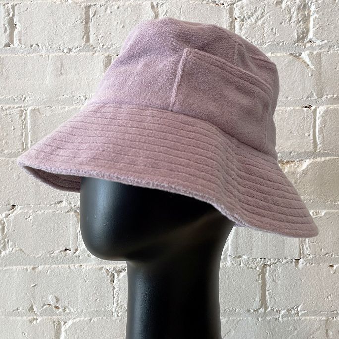 Lined towelling bucket hat with pocket.