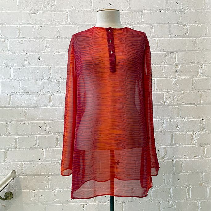 Sheer tulle collarless top.
