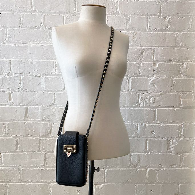 Cross-body micro bag with signature studs. With box and dustbag.