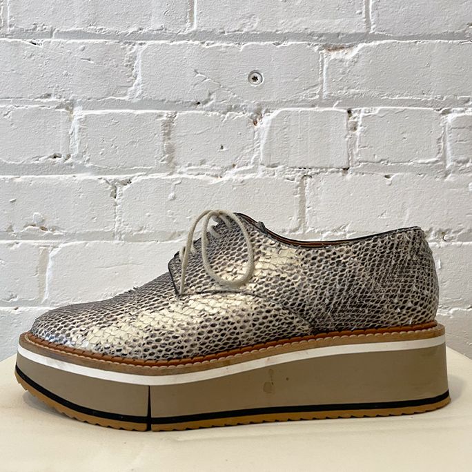 Snakeskin platfom lace-up.