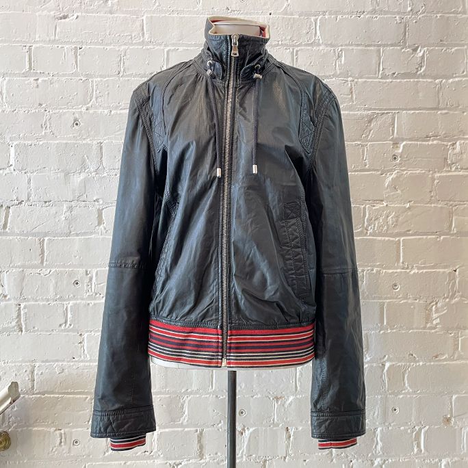 Biker-style leather jacket with pockets, fully lined.