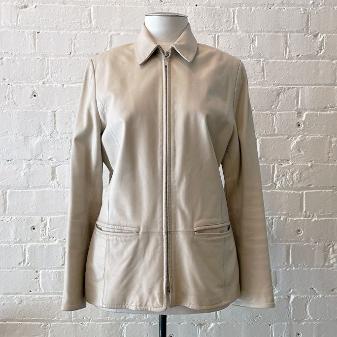 Cream leather jacket with pockets, fully lined.