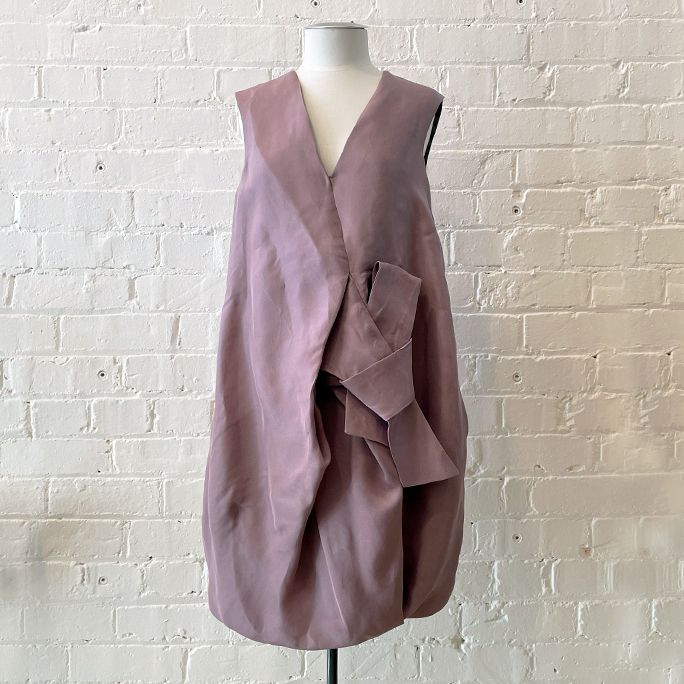 Sleeveless shift dress with pockets, fully lined.
