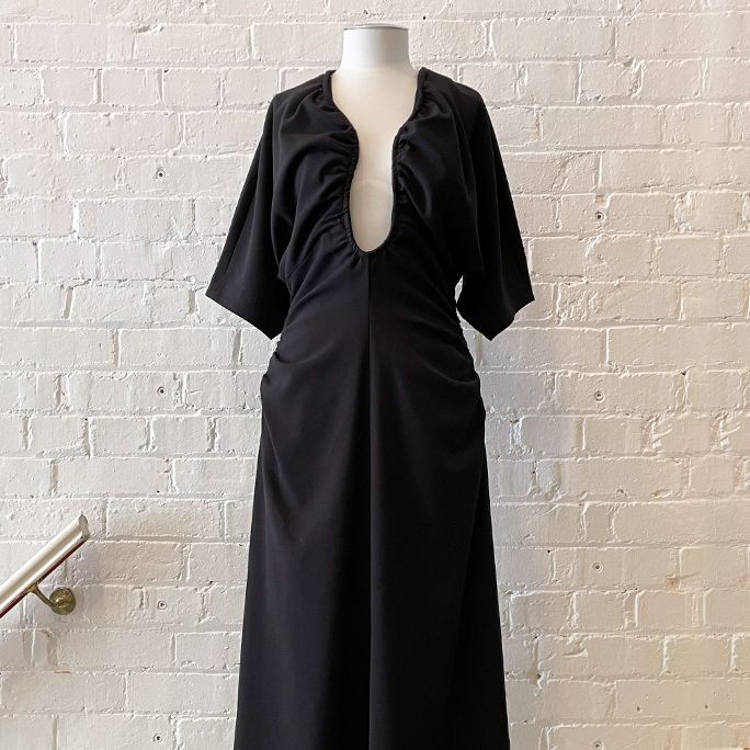 Sculptural dress, fully lined.