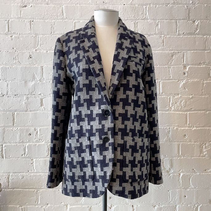 Woven jacket with patch pockets, fully lined.