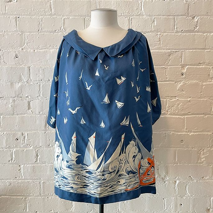Oversize boat neck silk top with nautical print.