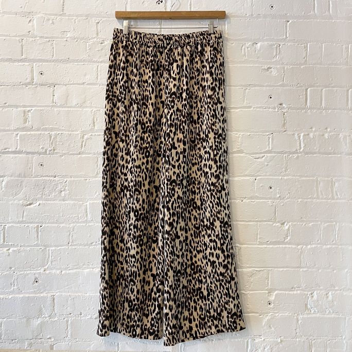 Animal print slouchy wide pants with pockets and drawstring waist.